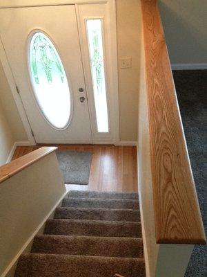 New front door, laminate flooring, carpet, and oak handrails.