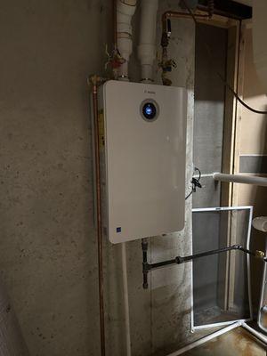 Bosch Greentherm tankless replacing two 50 gallon tanks