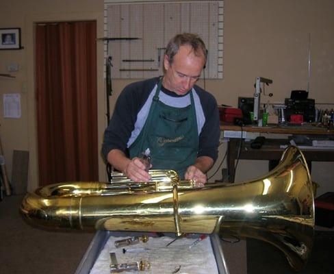 Paul working on a tuba.