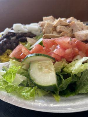 Chicken, rice, beans, and a side salad