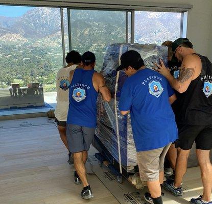 Moving a Grand piano through a new home and floor