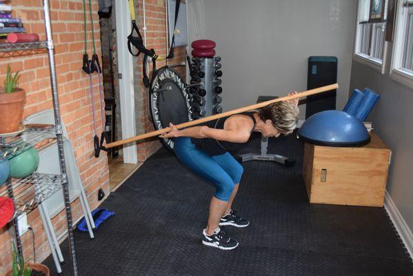 Bending with a flat back is crucial to prevent back injury