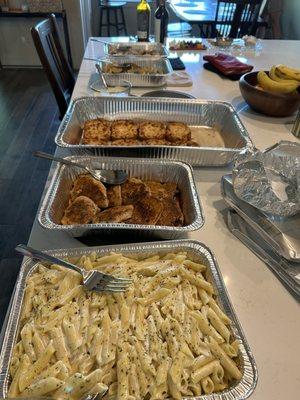 Chicken Alfredo catering with garlic bread, stuffed mushrooms and zucchini and squash