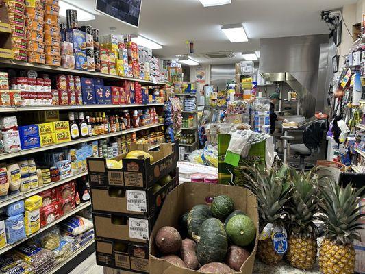 Small grocery section with fresh produce.