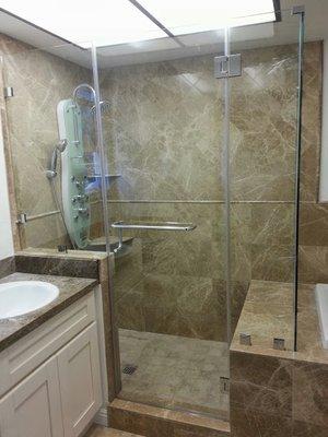 Custom shower with marble tiles.