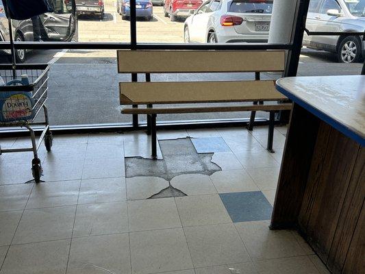 Inside of laundromat bench area and part of folding table