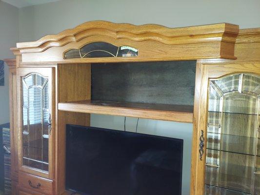 Back piece on entertainment center is backwards. Should oak side out.