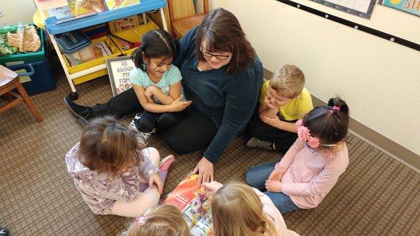 Ms. Karen with PreK class, sharing a book.