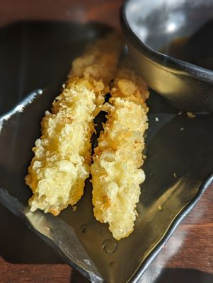 Shrimp tempura.  Comes in single pieces in All-You-Can-Eat but you can request more.