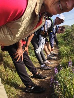 Stretching on trail above Golden Gate Bridge