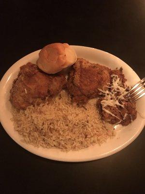 Delicious fried chicken, beans, and rice