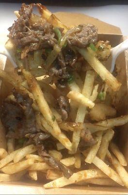 Surf n Turf Fries - Bulgogi beef, grilled onions, and popcorn shrimp.