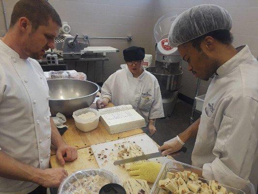 Bakery students work in bakery to fill bread orders as well as specialty desserts for cutomers