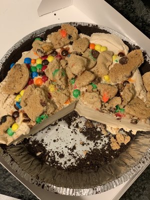 Ice cream pie with Oreo crust, coffee ice cream, and crushed M&M cookies