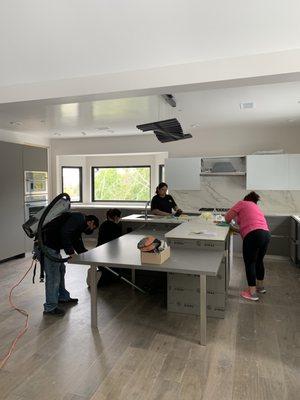 JJ & CC Post Construction Cleaning - Wiping down kitchen surfaces