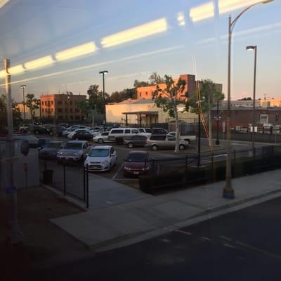 Parking lot #2. Almost full by the time the 6:40am train arrives. Train station is toward the lower right, about a 2 block walk.