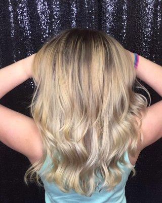 Fresh neutral toned blonde achieved with a mixture of hand painted balayage pieces and babylight foils.