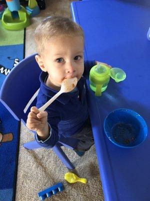 Baby Lu enjoying a snack at Miss Tigi's.