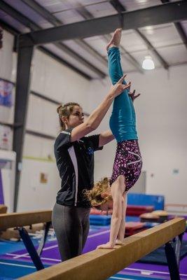 Coach Molly on beam