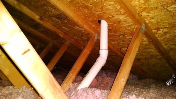 Attic prior to Mooney & Moses install. Note height of insulation and pink color