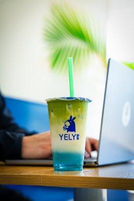 Yely's Matcha Latte is crafted with butterfly pea, homemade creamer, and USDA organic ceremonial grade Matcha.