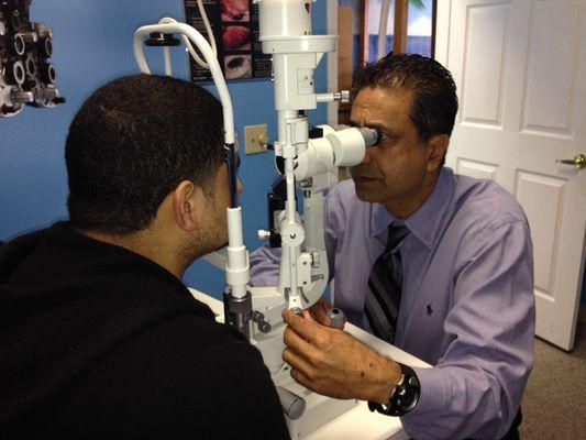 Dr. Khalfe checking the anterior segment of the Eye.