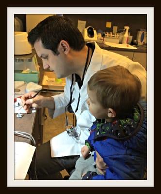 This is Dr. Brenner and his son.  He's watching his dad paint porcelain on his grandfather's crown.