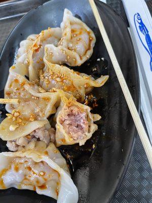 Raw meat inside the hot oil dumping.