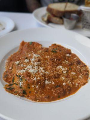 Short rib house made ravioli in Bolognese