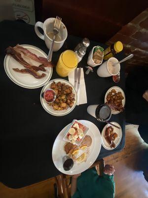 French toast, pancakes and bacon and herb potatoes