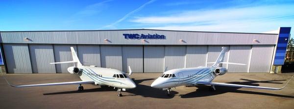 TWC Aviation hangar with a pair of Falcon 2000LX private charter jets