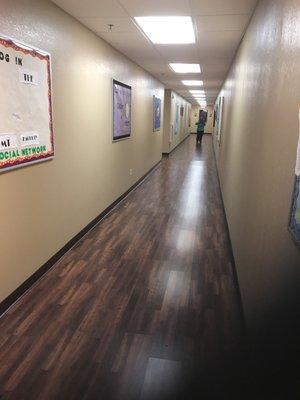 Long hallway to the break room and restrooms to the right and computer lab to the left