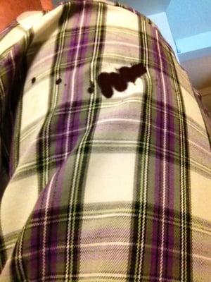 One of several stains made at the dry cleaners. Indelible, ruined the shirt. 3 weeks, two visits, 3 phone calls, no compensation