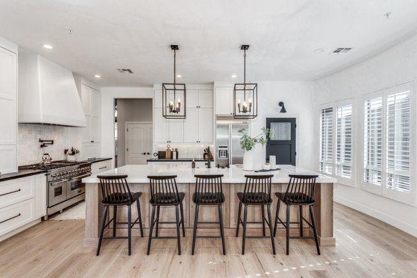 White kitchen with oak island in Scottsdale