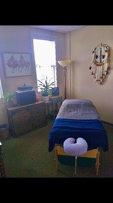 Here is a photo of his room with a hint of American Indian accents surrounding the room to represent his family heritage.