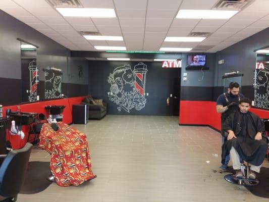 Miami and New York Barber Shop with a billiards table, ATM, and Wi-Fi.