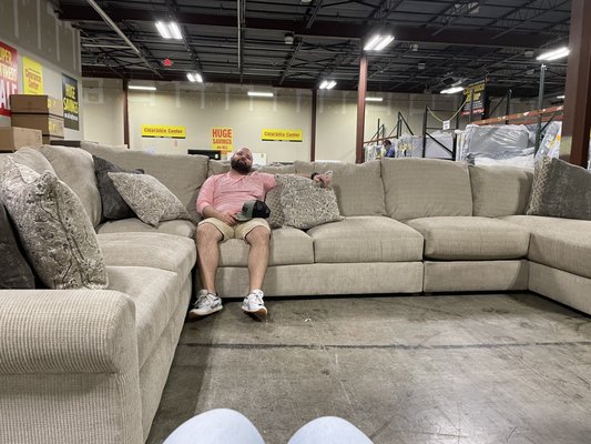 My husband on our new couch