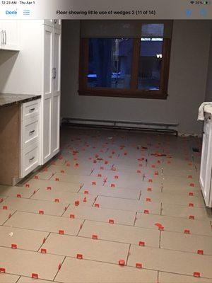 Use of floor leveling system.  How can it 
 keep the tiles straight without the wedges?!