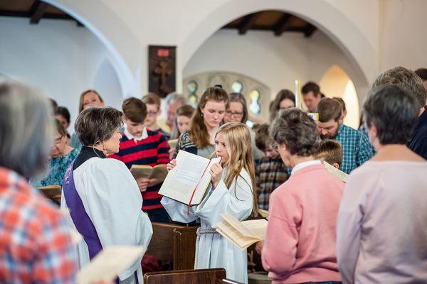 Reading from the Gospel during Sunday morning service