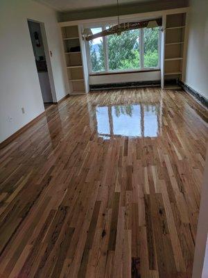 Refinished red oak wood floor, Bona Classic seal and Bona Mega finish coat.