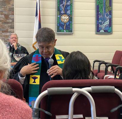 Pastor Tom explaining the symbols on his stole.