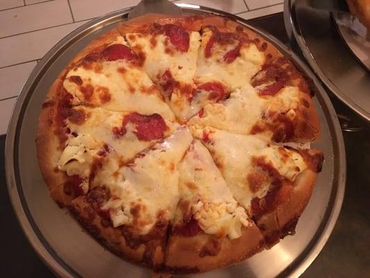 Small pizza with pepperoni and ricotta cheese