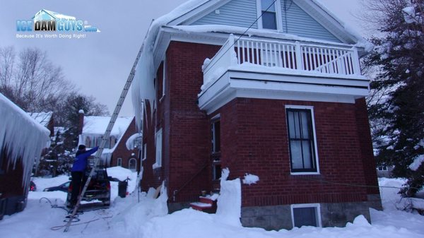 Ice Dam Guys getting onto the roof of a customer's home in Cleveland, OH.