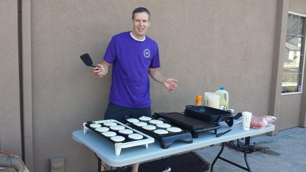 Dr Hammer serving up pancakes for his staff!