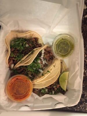 3 Asada tacos with Verde sauce and another hot sauce. Absolutely delicious!