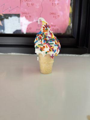 Mini vanilla soft serve with sprinkles. Very mini.