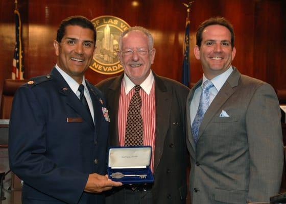 Richard Emanuele with Maj. Anthony E. Jones while he receives the Key To The City from Mayor Oscar Goodman.