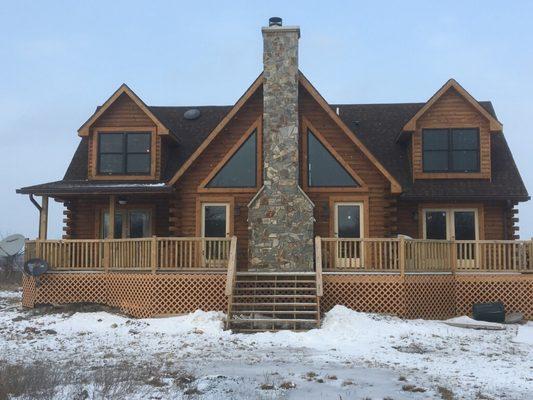 Log Cabin with Mountain Stone fireplace