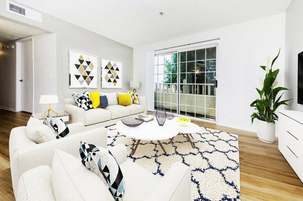 Large living room area with French doors leading to private patio