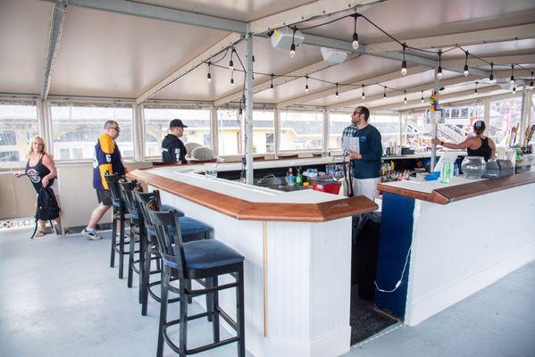 Our wrap around, full bar on the upper deck is sure to have everything you are looking for!